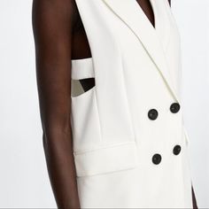 A Classy Piece For Every Closet Lapel Collar Vest For Spring, Chic Vest With Lapel Collar Outerwear, Chic White Vest With Pockets, Tailored Sleeveless Spring Outerwear, White Vest Outerwear For Spring, Chic Sleeveless Fall Blazer, Tailored Spring Vest Outerwear, White Fall Vest Outerwear, Spring Single Breasted Vest With Lapel Collar