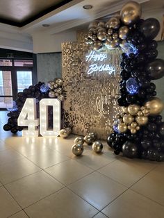 the number forty is displayed in front of balloons