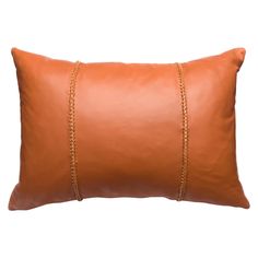 a brown leather pillow with gold chains on it