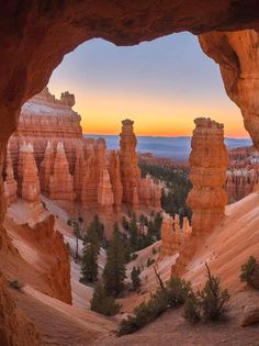 the sun is setting over hoodoos and trees in the valley below, as seen from an overlook point