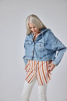 This is not your mother's denim jacket from the 80s -- The Denim Jacket 2.0 is a cropped, oversized jacket that will make any look instantly cooler Available for Pre Order, will ship around Sept. 13, 2022. Oversized Cropped Jacket, Casual Style, Spring Outerwear With Drawstring Hood And Relaxed Fit, Relaxed Fit Cropped Jacket For Spring Streetwear, Oversized Cotton Cropped Jacket For Spring, Hooded Cropped Jacket For Spring Streetwear, Spring Hooded Cropped Jacket For Streetwear, Oversized Cropped Denim Jacket, Trendy Hooded Cropped Jacket For Spring, Button Style