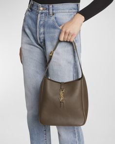 Saint Laurent "Le 5 À 7" hobo bag in leather    Adjustable buckle shoulder strap Golden hardware   Open top with YSL center strap   Approx. 6.7"H x 10.2"W x 4.3"D   Made in Italy Ysl 5 A 7 Bag, 5 A 7 Ysl, Ysl Hobo Bag, Ysl Hobo, Hobo Bag Outfit, Sac Yves Saint Laurent, Ysl Purse, Ysl Bags, Anthony Vaccarello