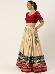 Step out in style this festive season with our fabulous off-white and maroon navratri lehenga choli! Designed with the perfect blend of traditional and modern elements, this ensemble is sure to make you the center of attention at any celebration.
The lehenga features an off-white color, crafted from lustrous tussar silk. With its sweeping 3.40-meter flair, expertly stitched with canvas and an attached cancan, this lehenga is designed to give you a graceful and elegant look. The inner lining of t Beige Anarkali Set For Navratri, Beige Anarkali Set For Navratri Festive, Off White Floor-length Traditional Wear For Navratri, Off White Sharara For Navratri, Festive Floor-length Cream Choli, Off White Sets For Navratri With Traditional Drape, Cream Traditional Drape Set For Navratri, Navratri Cream Traditional Drape Sets, Off White Navratri Sets With Traditional Drape