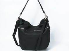 The hobo style bag was made 100% from highest quality full-grain italian leather. It can be worn both in crook of the elbow (short handle) as well as over the shoulder (adjustable long shoulder strap). The handbag is featured with a top zip. It is fitted with three zipped pockets: large at the front, smaller at the back and double in the inside, there is also a space to store a mobile phone. The bottom is stiffened. Fits easily A4 format (US Lettel format) and is very roomy, therefore it will be Natural Leather Bag, Slouchy Hobo Bag, Everyday Tote Bag, Everyday Handbag, Brown Leather Backpack, Hobo Style, Hobo Bags, Black Leather Bags, Leather Hobo Bag