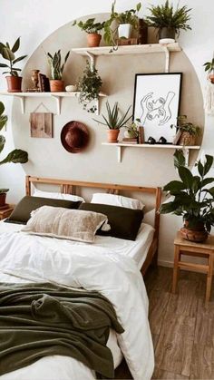 a bed with lots of plants on the shelves above it