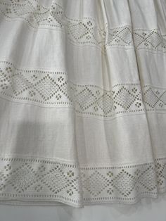 Elegant White Skirt With Cutwork Hem, Bohemian White Skirt With Embroidered Hem, White Embroidered Full Skirt, White Cotton Skirt With Broderie Anglaise, White Cotton Skirt With Cutwork Hem, White Embroidered Long Skirt, White Broderie Anglaise Cotton Skirt, White Embroidered Bohemian Skirt, Flowy Lace-trimmed Skirt