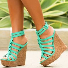 Step into summer with style and comfort in our Turquoise Cork Wedges Open Toe Ankle Strap Platform Sandals. These striking sandals feature a vibrant turquoise hue that catches attention wherever you go. The cork wedge heels provide a fashionable lift while ensuring your comfort throughout the day. With an open-toe design and secure ankle strap, these versatile sandals are perfect for any occasion. Elevate your fashion game with these chic and breezy platform sandals, a must-have for embracing the sunny season in style. Color: Turquoise Heel Type: Wedge heel Heel height: 5.51" / 140 mm approx Product measurements were taken using size 8. Please note that measurements may vary by size. Striking Turquoise Hue: These sandals boast a vibrant turquoise color that adds a pop of boldness to any ou Green Wedge Sandals With Round Toe For Vacation, Chic Green High Heel Wedge Sandals, Green Wedge Sandals With Heel And Ankle Strap, Chic Green Wedge Sandals With Open Heel, Chic Green Open Heel Wedge Sandals, Green Ankle Strap Wedge Sandals For Summer, Green Summer Wedge Sandals With Ankle Strap, Chic Green Open Toe Wedge Sandals, Green Ankle Strap Wedge Sandals With Platform