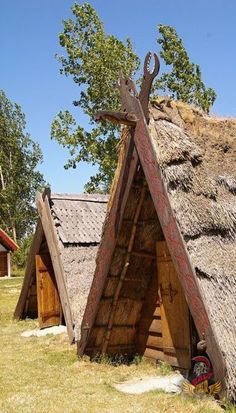 some kind of thatched roof with a cross on it