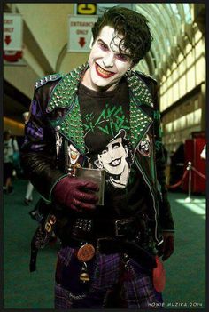 a man dressed as the joker in an airport