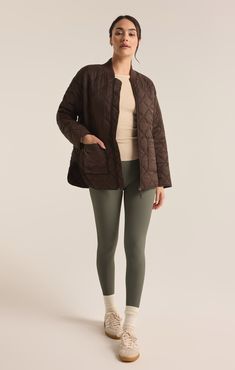 Stay warm and stylish in this oversized quilted bomber jacket, made from soft yet durable nylon taffeta fabric with a stand collar and ribbed accents. The zipper closure and patch pockets add functionality, making it a versatile choice for layering. Z SUPPLY Activewear Women's Sunrise Quilted Nylon Bomber Jacket, Coffee Bean, Extra Small Sporty Long Sleeve Quilted Puffer Jacket, Winter Sporty Quilted Jacket, Sporty Long Sleeve Puffer Quilted Jacket, Sporty Winter Quilted Jacket, Sporty Quilted Jacket For Winter, Sporty Long Sleeve Quilted Jacket For Fall, Versatile Quilted Outerwear For Fall, Versatile Quilted Fall Outerwear, Oversized Quilted Nylon Outerwear