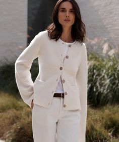 Cooper Cardigan Warm Ivory Featuring a structured hourglass silhouette and a very slight bell sleeve, this chic knit is unlike anything we’ve done before. Ultra-soft wool cashmere and a classic shape are easily styled with everything from wide-leg trousers to your favorite skirt. 70% wool, 30% cashmere. Made in China. Chic Fitted Cardigan With Button Cuffs, White Cashmere Cardigan With Button Closure, Elegant Button-up Sweater For Business Casual, Elegant Sweater Coat For Formal Occasions, Classic Fitted Sweater Coat For Work, Elegant Cream Button-up Sweater, Elegant Spring Sweater For Business Casual, Elegant Cream Long Sleeve Cardigan, Chic Fitted Cashmere Cardigan