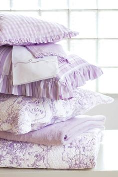 a stack of pillows sitting on top of a table