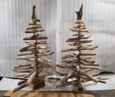 two wooden christmas trees made out of driftwood