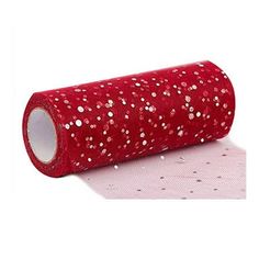 a roll of red sequinized fabric with white dots on the top and bottom