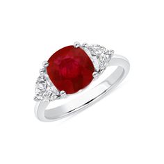 This beautiful ring centers a captivating 3.25ct ruby unearthed from a newly discovered mine in Greenland, where the gems are said to be the oldest on Earth. These gems have been buried under the Polar Ice Cap, which is now slowly melting to reveal these unique, billion-year-old treasures. This ruby is flanked by two epaulette diamonds mounted in platinum. Handcrafted and one-of-a-kind. 3.25ct vivid red cushion ruby; Greenland government certificate 2 epaulette diamonds totaling 0.84ct E color V Gia Certified Ruby Ring, Formal Cushion Cut Ruby Ring, Red Ruby Gemstones With Prong Setting, Classic Three Stone Ruby Ring, Classic Three-stone Ruby Ring, Timeless Red Ruby Ring With Prong Setting, Timeless Ruby Ring With Center Stone, Cushion Cut Ruby Gemstone Rings, Cushion Cut Ruby Ring With Center Stone