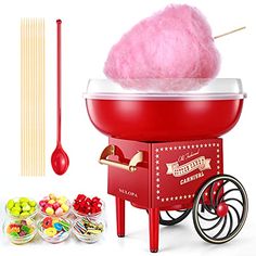 an old fashioned cotton candy machine with lollipops