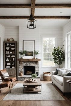 a living room filled with furniture and a fire place