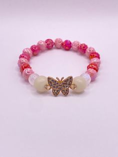 Beautiful handmade beaded bracelet with butterfly pendant White Butterfly Charm Bracelet For Gift, White Butterfly Bracelet For Gift, White Beaded Butterfly-shaped Jewelry, White Beaded Butterfly Shaped Jewelry, White Beaded Butterfly Jewelry, Elegant Jewelry With Butterfly Charm And Round Beads, Pink Butterfly Charm Bracelet Jewelry, Pink Butterfly Charm Bracelet, Butterfly Charm Jewelry With Round Beads As Gift