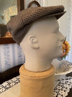 Made by Ascot Caps, this newsboy hat is 40 per cent wool, 55 per cent polyester and 5 per cent other fibres, in classic shades of light moss green, light brown and dark brown. The hat has one snap on the brim. It is fully lined with rusty brown fabric lining. Fits men's size 7 1/8. In very good condition. Fitted Felt Cap For Fall, Classic Felt Cap Hat One Size Fits Most, Fitted Casual Felt Hat Flat Cap, Classic One Size Fits Most Felt Cap, Classic Short Brim Beret For Fall, Brown Cloche Cap For Fall, Classic Winter Beret, Fitted Winter Flat Cap Felt Hat, Casual Wool Flat Cap Felt Hat