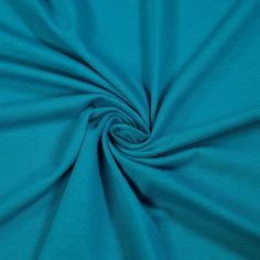 a close up shot of the fabric in teal blue, which is very soft