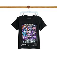 a t - shirt hanging on a clothes line with an image of monsters in the background