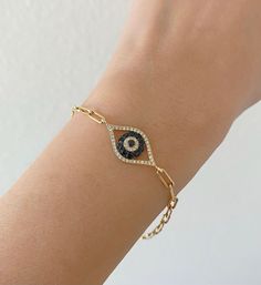 14K Gold Diamond And Sapphire Evil Eye Bracelet. Paperclip Chain Bracelet. Perfectly Worn Alone Or Layered With Your Other Bracelets. Evil Eye Jewelry Are Known To Ward Off Bad Spirits And Bring Good Luck. Jewelry Comes In A Cute Box Ready To Present. -All Jewelry Is New And Inspected For Quality Assurance. -Jewelry Is Crafted In Genuine High Quality 14K Gold. -We Do Not Sell Gold Plated. - All Of Our Diamonds And Gemstones Are Natural. Not Simulated Or Lab Grown. Product Detail: Metal: 14k yell Luxury 14k Gold Paperclip Bracelet, Elegant 14k Gold Evil Eye Bracelet Gift, Elegant Yellow Gold Evil Eye Bracelet, Elegant Evil Eye Bracelet, Elegant Gold Plated Evil Eye Bracelet, Elegant Evil Eye Bracelet With Adjustable Chain, Luxury White Gold Paperclip Bracelet As Gift, Elegant Adjustable Yellow Gold Evil Eye Bracelet, Elegant Gold-plated Evil Eye Bracelet