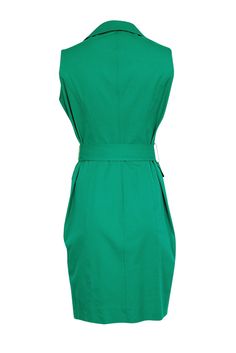 Amp up your office wardrobe with this chic, elegant, and timeless green midi dress from Donna Karan. The unique collared and sleeveless design paired with a waist tie adds a modern minimalist twist. Perfect for any RSVP event, this dress is versatile enough to wear now and wear later. Pair with sandals, pumps, or chic white sneakers for a complete look! Size 8 Made in USA Shell 95% Cotton, 5% Spandex Lining 96% Polyester, 4% Spandex Collared neckline Sleeveless Midi length Button down detail Two bust pockets Two side pockets Removable waist belt Bust 39" Waist 33" Shoulder to hem 38.5" Green Belted Midi Length Dresses, Green Belted Midi Dress, Elegant Green Belted Dress For Work, Chic Green Belted Dress, Elegant Green Dress With Tie Waist, Chic Green Dress With Tie Waist, Fitted Green Belted Dress, Belted Green Dress For Workwear, Belted Green Dress For Work