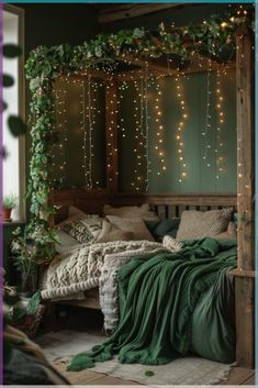 a bed with green sheets and lights on the headboard is in front of a window