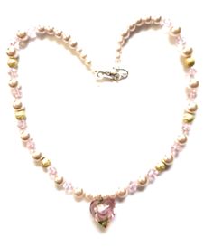 Handmade beaded necklace with pink faux pearls, crystals, gold glitter beads, a blown glass heart pendant and a silver S hook clasp. Necklace is 20 inches long. Pendant is 1 inch long and 1 inch wide. Pink faux pearls are 3 to 9mm. Pink bicone crystals are 5mm. Gold glitter beads are 7mm. Unique. One of a Kind. Beautiful colors. Great gift idea for that girl that likes pink. Pink Pearl Necklace With Heart Beads Gift, Gold Heart-shaped Pearl Beaded Necklaces, Beaded Pearl Necklace For Valentine's Day, Gold Heart-shaped Pearl Beaded Necklace, Valentine's Day Pink Pearl Charm Necklace, Pink Beaded Necklaces With Pearl Charm, Pink Pearl Necklace With Heart Beads, Heart-shaped Pink Pearl Necklace, Pink Heart-shaped Pearl Necklace