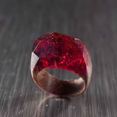 "Resin Ring made of exotic wood and epoxy resin. Perfect gift for women. I pick over the best materials while manufacturing rings. Natural high-quality wood out of noble tree species encloses a piece of nature, spirit and energy of a place it was growing at. Resin used is characterized by high clarity, hardness and also great light refraction index. It is hypoallergic, ecological, so it doesn't cause any skin reaction. After shaping up and polishing resin acquires gloss and sparkle and isn't bei Polishing Resin, Ring Resin, Resin Rings, Red Ring, Red Rings, Resin Uses, Jewelry Resin, Wood Ring, Wooden Ring