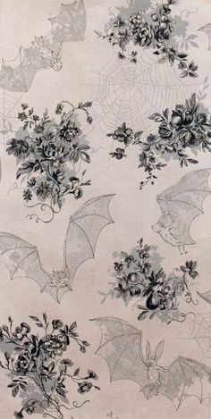 a bat and flowers pattern on a white background