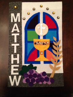 a card with a cross, chalicee and grapes on it