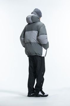 The Patchwork Down Jacket combines simplicity, avant-garde style, and vibrant energy. It features a Morandi color palette with a three-color splicing design, a logo print on the left waist, and an adjustable hood hem. The cuffs and jacket hem are snug, and the lining is made from anti-drilling velvet fabric. Filled with 268G of high-quality white duck down, this jacket is made from premium fabric and is slightly oversized.Morandi color scheme with three-color splicing design. Logo print on the l Hooded Patchwork Track Jacket For Streetwear, Functional Hooded Patchwork Outerwear, Black Patchwork Nylon Outerwear, Luxury Hooded Garment-dyed Outerwear, Luxury Garment-dyed Utility Jacket, White Ducks, Duck Down, Avant Garde Fashion, Three Color