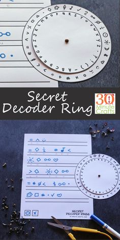 the secret decoder ring is shown with scissors and paper