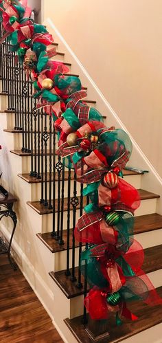 a set of stairs decorated with christmas decorations