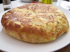 a large piece of bread on a white plate