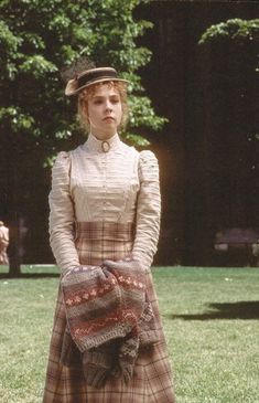 an old photo of a woman in a dress and hat with the words anne of green gabless on it