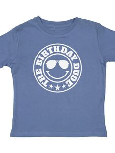 About this product The Birthday Dude Short Sleeve T-Shirt is a fun and festive t-shirt for celebrating the birthday boy! Features: Shirt Color: Indigo Graphic Color: White Material: 100% Cotton Features: Tagless inside neck label for an itch-free wear Fit: Toddler Unisex; True to Size Care: Machine washable, tumble dry low, wash with like colors Each t-shirt is hand pressed with love using baby and child safe inks. Details • Care Instructions: Machine wash • Fabric: 100% Cotton • Product Languag Fun T-shirt For Father's Day Birthday, Playful Birthday T-shirt With Text Print, Playful Text Print Birthday T-shirt, Blue Cotton T-shirt For Birthday Gift, Funny Blue Tops For Birthday, Fun Blue T-shirt For Father's Day, Blue Graphic Print T-shirt For First Birthday, Fun Graphic Print T-shirt For First Birthday, Blue T-shirt For Father's Day Birthday