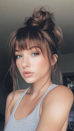 💁‍♀️ Save for later 👉 Tap to see all quick updos for medium hair! Discover how a bun with bangs can transform your look in minutes. This style combines the classic bun with playful bangs, offering a chic yet casual vibe. Perfect for any occasion, it’s a must-try for those with medium hair. Click to explore more styles! #BunWithBangs #MediumHairUpdos #QuickHairstyles #EasyHairdos #BangsStyle Bangs Up Do, Hairstyles For Medium Length Hair Easy Simple Casual Updos, Easy Hairstyles For Medium Hair With Bangs, Fast Updos For Medium Hair, A Bun With Bangs, Bangs With Hair Up, Messy Updo With Bangs, Casual Hairstyles For Medium Hair, Quick Updos For Medium Hair