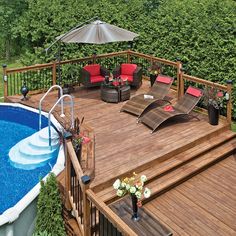 an above ground pool surrounded by wooden decking