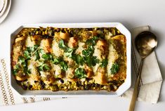 a casserole dish with meat, vegetables and cheese