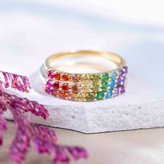 ---------------------------------------------------- Rainbow Eternity Band THE PRODUCT - Weather you're buying this for your love of rainbows, multiple gemstone properties, to show your support of the LGTBQ+ community, or celebrate your pet who have crossed the rainbow bridge, this is the most beautiful all natural gemstone rainbow ring you will ever find!  - This handmade eternity band is made with natural : ruby, garnet, citrine, lemon topaz, peridot, emerald, blue topaz, and amethyst. - We ha Rainbow Stackable Jewelry For Promise Ring, Adjustable Rainbow Gemstone Ring, Rainbow Gemstone Jewelry Ring, Multicolor Half Eternity Rings As Gift, Adjustable Multi-stone Rainbow Jewelry, Multicolor Jewelry For Pride Gift, Pride Multicolor Jewelry Gift, Rainbow Multi-stone Jewelry For Promise Ring, Round Multicolor Jewelry For Promise