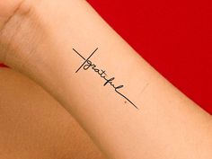 a woman's arm with a tattoo that says, hope on it and the word faith written in cursive font