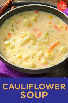 a bowl of cauliflower soup on a plate with a hot dog next to it