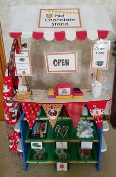 an outdoor stand with lots of items on display for children's birthdays and other celebrations