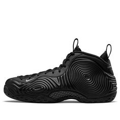 Introducing the Nike Air Foamposite One x Comme des Garçons Homme Plus. This collaboration brings you a sleek, monochrome take on the classic hoops shoe, originally released in 1997. The blacked-out synthetic upper is covered in wavy circular patterns, with branding elements including an embroidered mini-Swoosh and "Comme des Garçons Homme Plus" inscribed on the heel tab. The herringbone-traction rubber outsole features Penny Hardaway's 1 Cent logo. Professional yet casual, this sneaker is perfe Penny Hardaway, Nike Foamposite, Comme Des Garcons Black, Retro Basketball Shoes, Runway Shoes, Foam Posites, Circular Pattern, Co Design, Nike Basketball