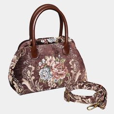 a floral purse with a brown strap and matching handbag, on a white background