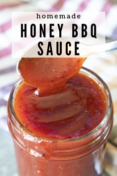 homemade honey bbq sauce in a mason jar with a spoon sticking out of it