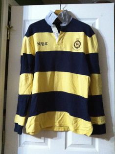 polo ralph lauren men's pre-owned yellow/blue 100%cotton long sleeve equestrian polo shirt size: XL custom fit personal collection underarm to underarm: 23 1/2" underarm to end of sleeve: 20 1/2" shoulder seam to shoulder seam: 21" length from the back of the collar to hem: 32 1/2" Long Sleeve Cotton Polo Shirt For College, Cotton Long Sleeve Polo Shirt For College, Yellow Long Sleeve Cotton Polo Shirt, Ralph Lauren Polo Shirt, Ralph Lauren Polo Shirts, Ralph Lauren Polo, Dress Code, Polo Ralph Lauren Mens, Dress Codes