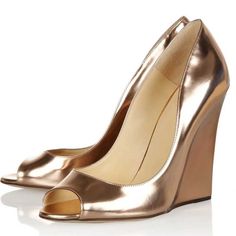 Step into elegance with our Champagne Metallic High Heels. These Peep Toe Wedge Pumps are perfect for evenings, blending style and comfort seamlessly. Elevate your look effortlessly. Color: Champagne Heel Type: Wedge heel Heel height: 4.72" / 120 mm approx Product measurements were taken using size 8. Please note that measurements may vary by size. Toe: Peep toe Padded insole for all-day comfort. Champagne color explains the personality of nobility. The wedge helps to reduce the pressure on your foot. Customization service would be provided. Handcrafted US sizing. Fits true to size. Gold Elegant Platform Sandals, Elegant Gold Platform Sandals, Elegant High Heel Wedge Sandals For Evening, Gold Closed Toe Platform Wedge Sandals, Gold Open Toe Platform Wedge Sandals, Luxury Gold Platform Heels, Elegant High Heel Wedge Sandals For Formal Occasions, Luxury Gold Wedge Sandals For Spring, Elegant Gold High Heel Wedge Sandals